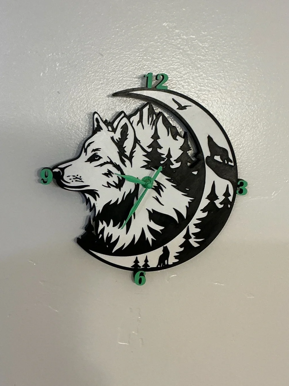 Wolf Moon Black and White Wall Clock with Green Accents